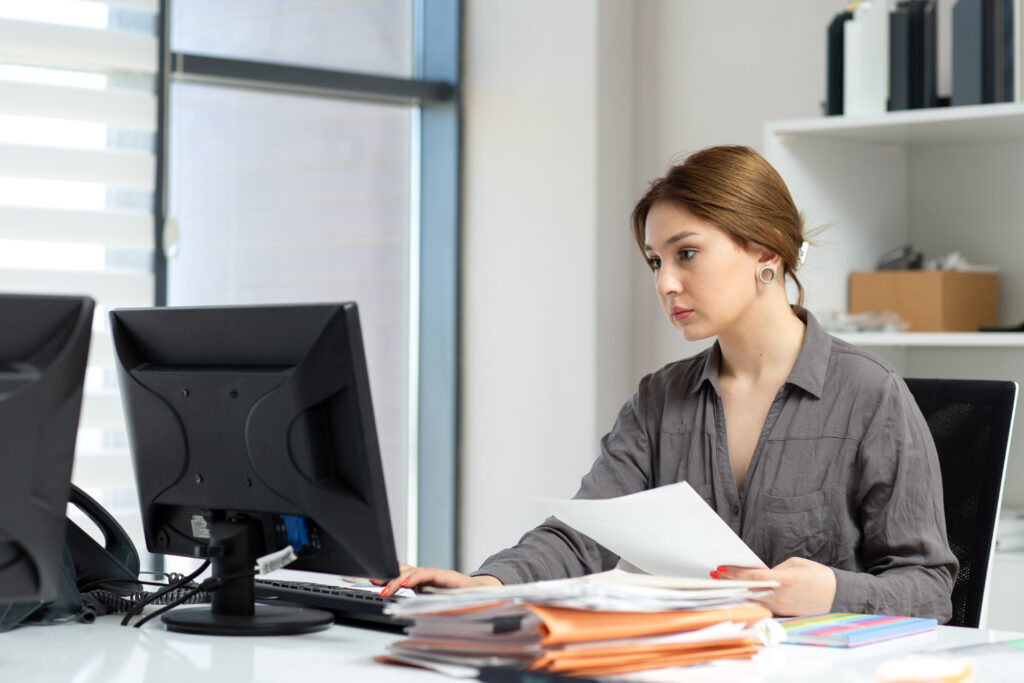 Front View Young Beautiful Lady Grey Shirt Working With Documents Laptop Sitting Inside Her Office Daytime Building Job Activity 1024x683